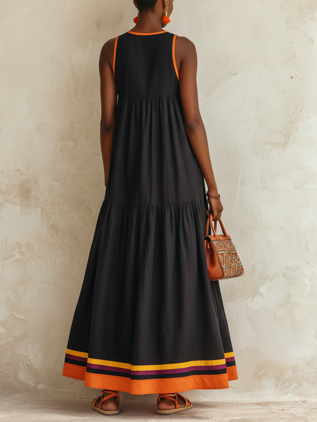 Federica | Black tiered maxi dress with orange trim and multicolor hem